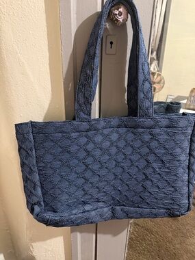 Blue reusable tote bag.